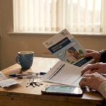 Couple reviews shared ownership documents at home