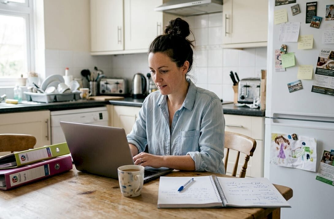 UK business owner updating marketing plan at home
