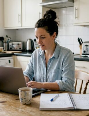 UK business owner updating marketing plan at home