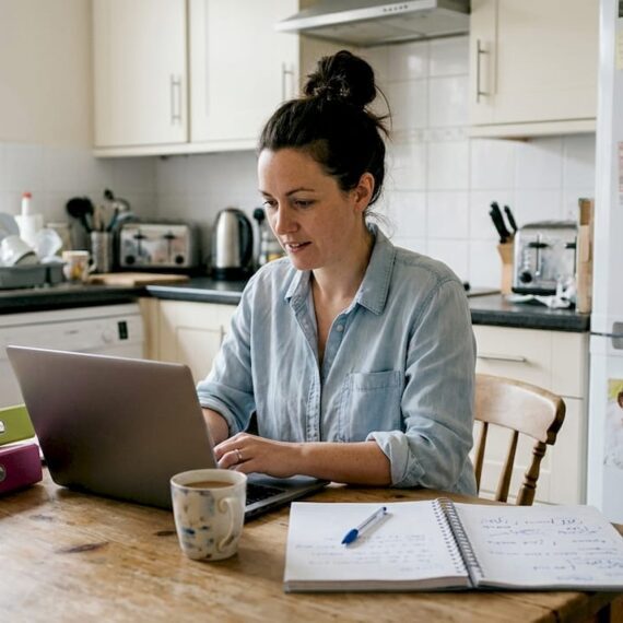 UK business owner updating marketing plan at home